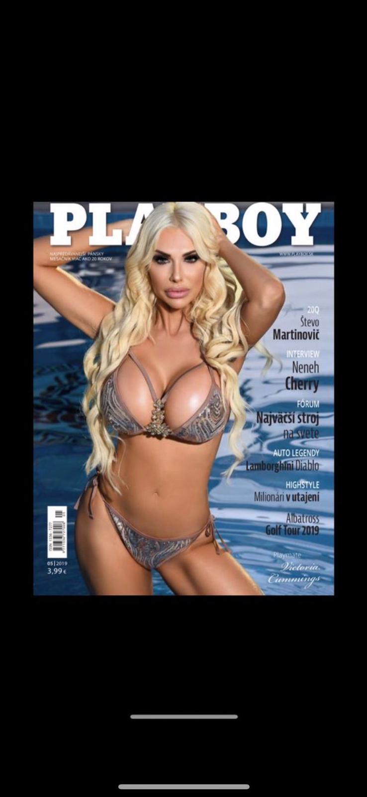 Tori Cummings on the front page of playboy in grey swimwear showing off her breasts.