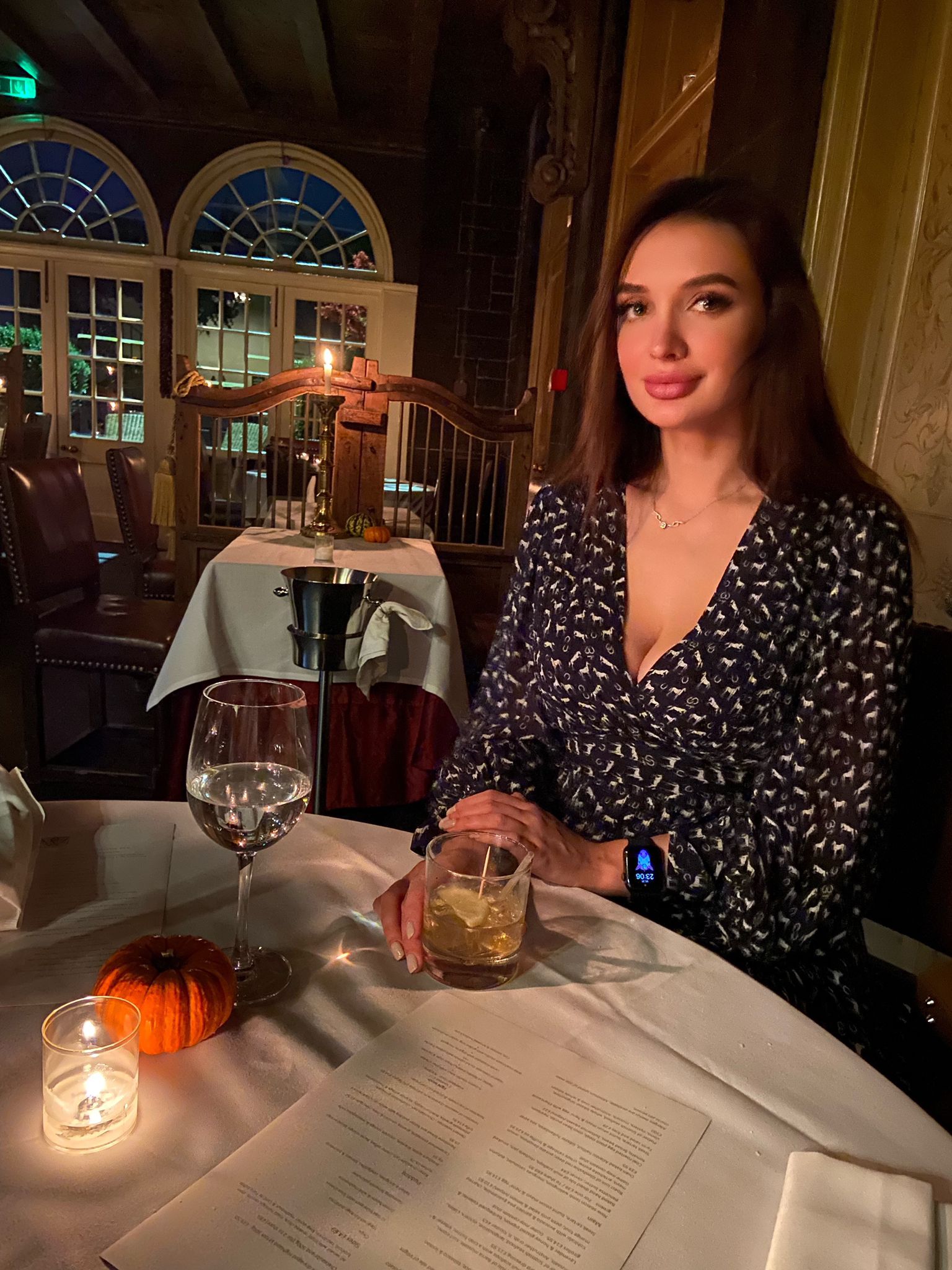 Evelyn at a table in a fancy restaurant