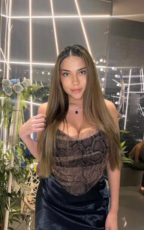 Gala standing at a lavish event 