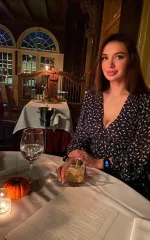 Evelyn at a table in a fancy restaurant