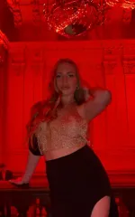 Alessandra taking a selfie in red lighting