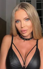 Joanna Bujoli taking a selfie while wearing a choker and black bra 