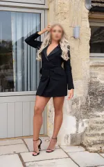 Zoe standing in a black blazer 