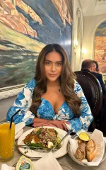 Gala enjoying a lovely meal in a blue and white top 