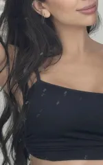 Carla taking a selfie in a black top 