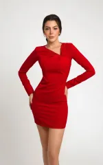 Agnes standing in a red dress 